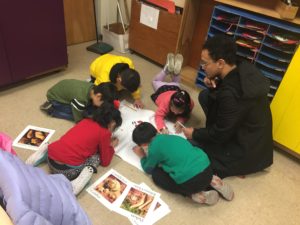 Leon facilitating healthy eating workshop with students at Castelar Elementary